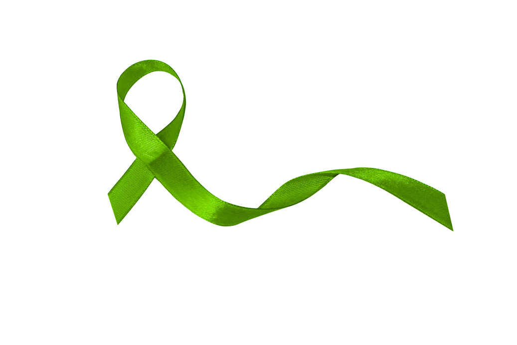 Lymphoma cancer awareness green ribbon.