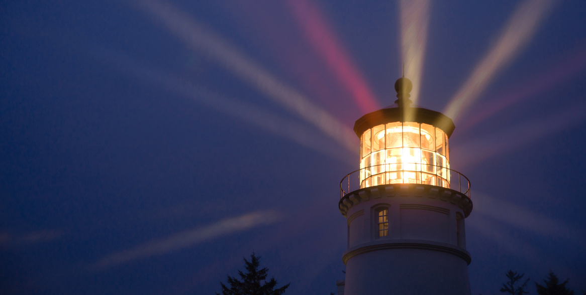 Lighthouse Beams Illumination into Rain Storm Maritime 